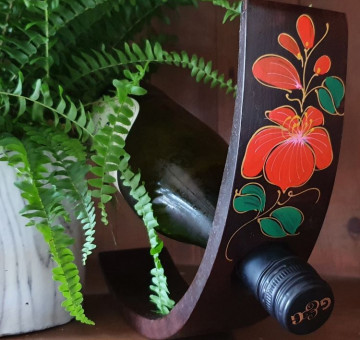 hand carved curved wine bottle holder orange blossom