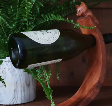wooden hand carved curved balancing wine bottle holder cat design