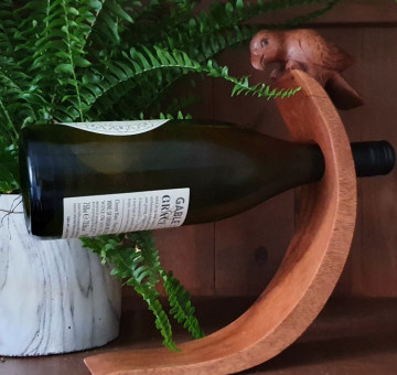 Hand Carved Curved Balancing Wine Bottle Holder with a Parrot design
