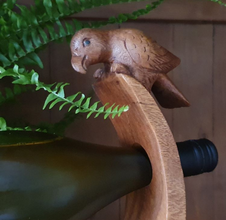 hand carved curved balancing wine bottle holder with a parrot design