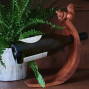 hand carved curved balancing wine bottle holder with a squirrel design