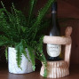 hand carved suar wood wine bottle holder in the shape of a turtle