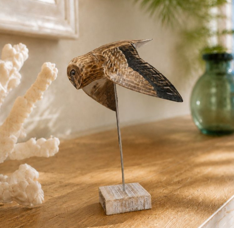 Wooden hand carved and painted flying owl on plinth