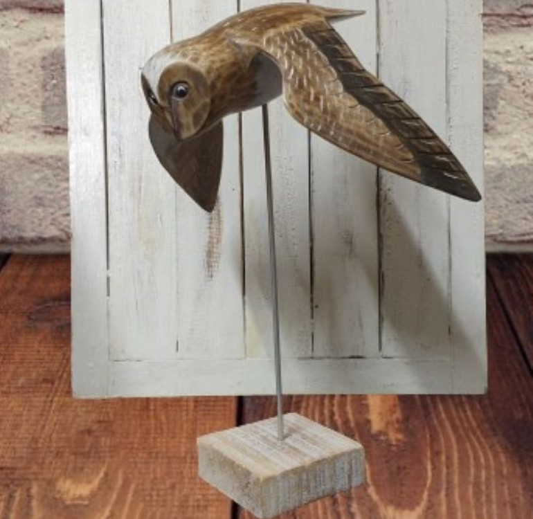 wooden hand carved and painted flying owl on plinth