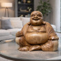 a hand carved sitting laughing buddha sculpture