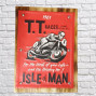 A wooden and tin red sign decorated with TT Isle of Man