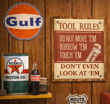 wooden and tin novelty art with my tool rules decorated on it