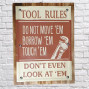 wooden and tin novelty art with my tool rules decorated on it