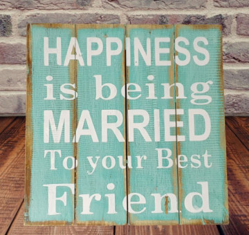 hanging painted sign on wood with words Happiness is being married to your best friend