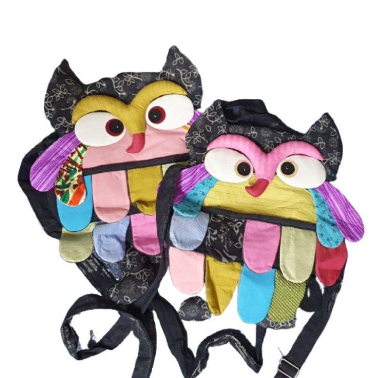 an image of 2 handmade patchwork owl handbags, made of recycled materials, long hanging loop and zip up back.