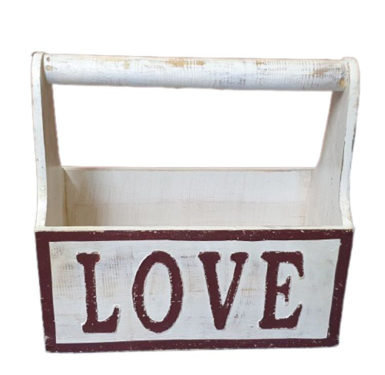 A wooden white hand painted crate with handle with LOVE painted on it in browny red