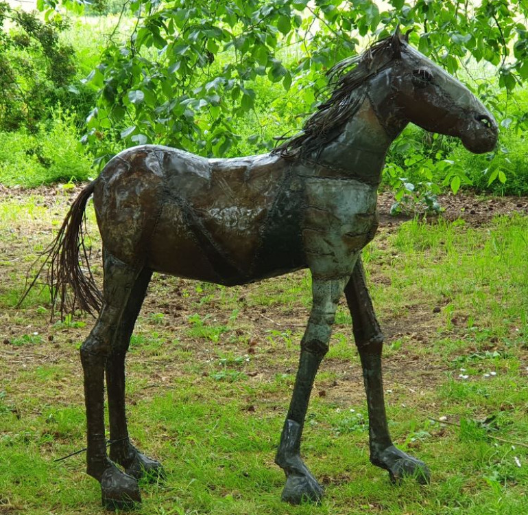 a recycled metal horse sculpture, statue for the garden