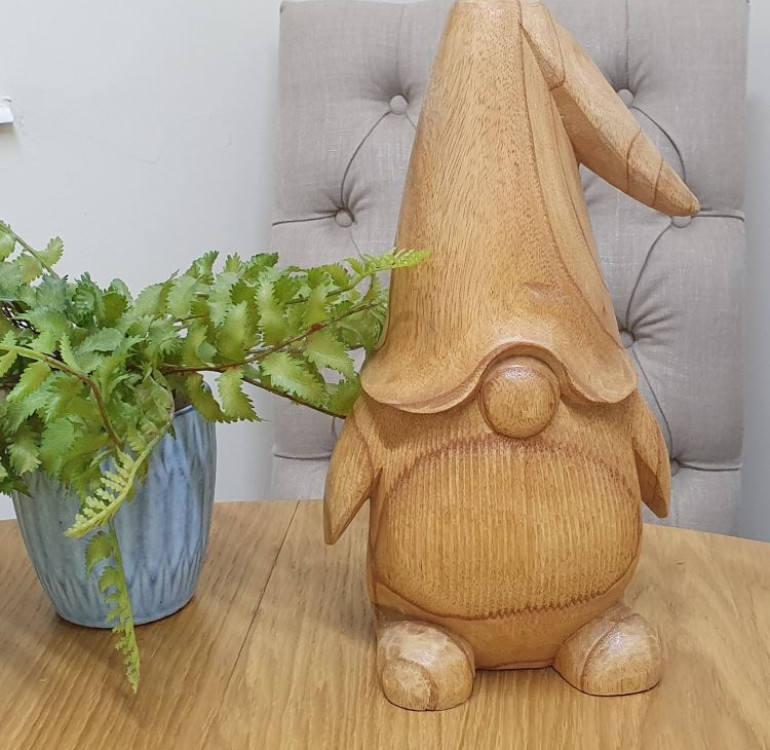 A hand Carved wooden gonk