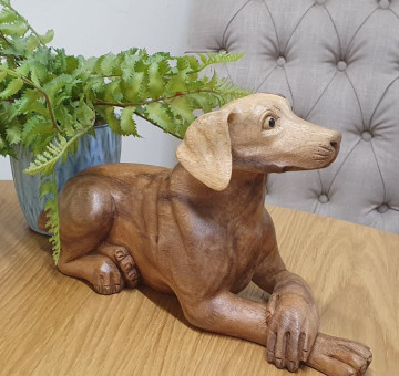 a hand carved wooden dog, Pointer