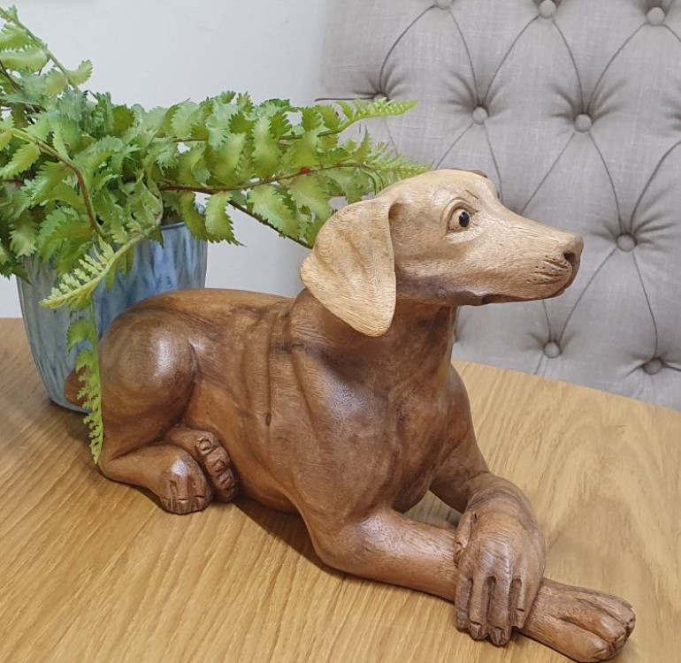 a hand carved wooden dog, Pointer