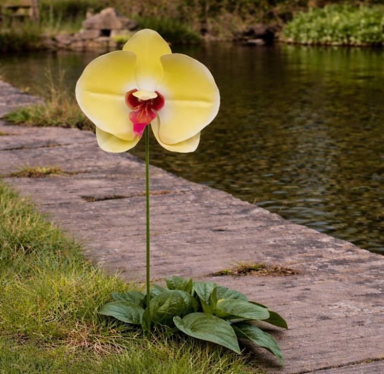 an image of a single stem metal yellow orchid flower ornament outdoor sculpture garden accessory decoration