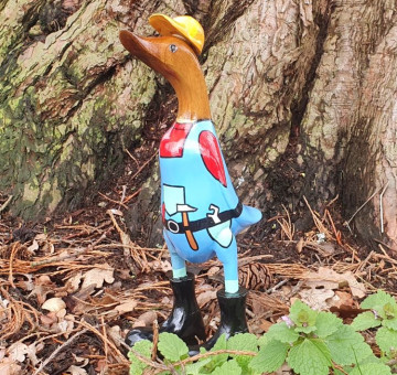 an image of a bamboo duck dressed hand painted as a builder handyman