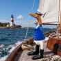 a hand carved bamboo duck with the character of a Sailor in the Navy