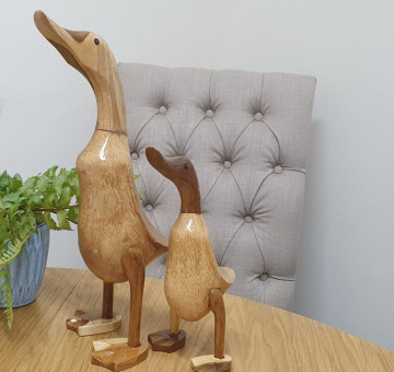 an image of 2 bamboo ducks hand carved with webbed feet in a natural wood finish
