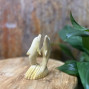 Hand-Carved Wooden Dolphin Statue (11 cm) Bring the beauty of the ocean into your home with this elegant hand-carved wooden sculpture featuring two dolphins twisting gracefully out of the water. Expertly crafted from natural wood, each piece showcases unique grain patterns and smooth, detailed carving that capture the fluid motion of the dolphins. Standing 11 cm high, this compact statue is perfect for a shelf, desk, or mantelpiece, adding a touch of coastal charm and natural artistry to any space. Features: Height: 11 cm (approx. 4.3 inches) Material: Hand-carved natural wood Design: Two dolphins leaping and twisting from the waves Finish: Smooth polished surface with visible wood grain Perfect for: Ocean lovers, beach décor, and nature-inspired interiors Celebrate craftsmanship and marine beauty with this timeless wooden dolphin sculpture — a small yet captivating accent that brings serenity and movement to your décor