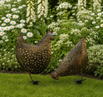 An image of a pair of hand crafted metal chickens for your garden border.
