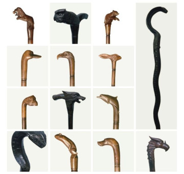 a selection of handmade carved wooden decorative walking sticks