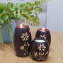 an example of a set of 3 hand carved barrel shape candle holders with a flower design, please note flower designs differ from set to set