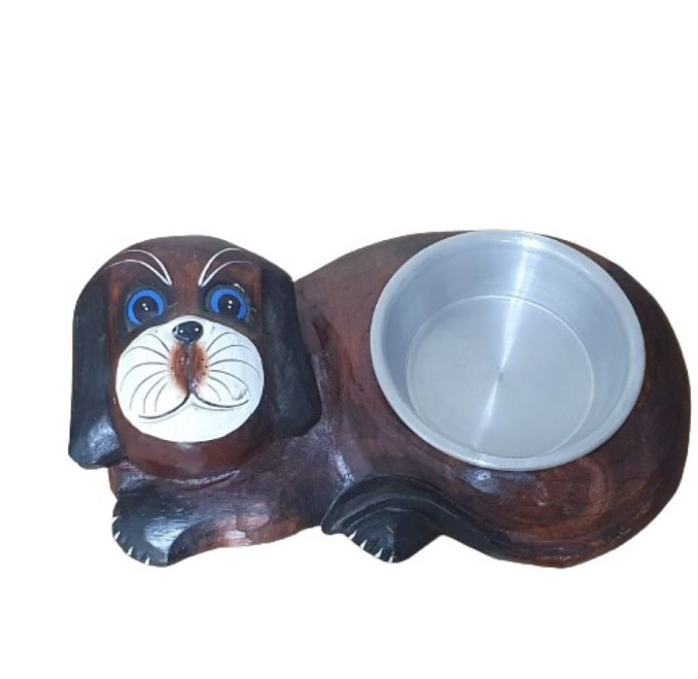 a handcarved lying down brown dog with a fitted bowl where its tummy is