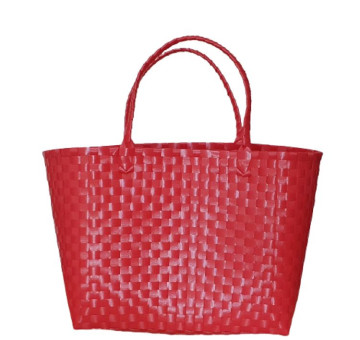 bright red recycled plastic hand woven bag