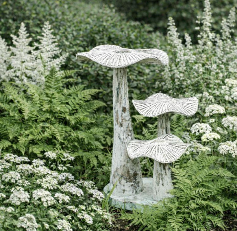 hand carved and painted white wooden flat top mushrooms on base set for outdoors
