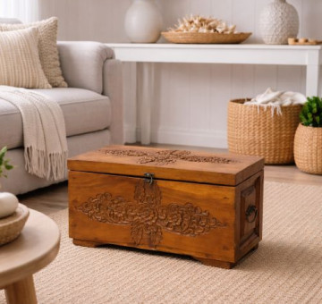 a large hand carved wooden chest with latch and carrying handles