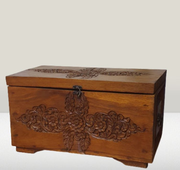 a large hand carved wooden chest with latch and carrying handles