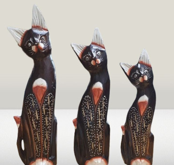a set of 3 hand carved wooden cat with a hand painted design in brown and white