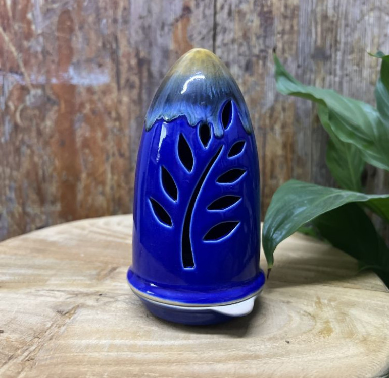 a handmade ceramic incense holder burner in a royal blue colour, cone shaped with an ochre finish top.
