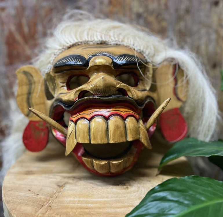 a handmade and hand painted brown Barong mask