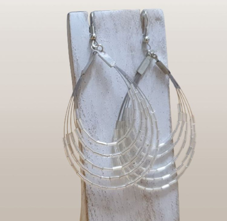 a pair of handmade white beaded hoop earrings