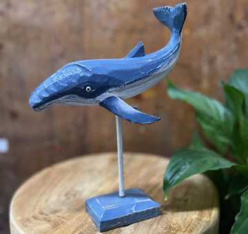 a hand carved and hand painted whale