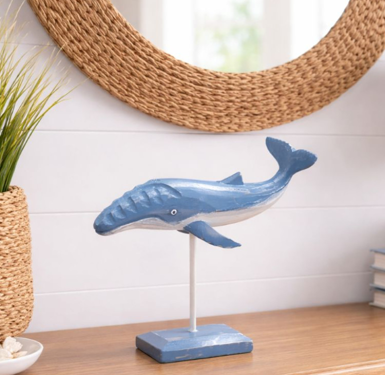 a hand carved and hand painted whale