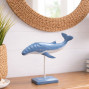 a hand carved and hand painted whale