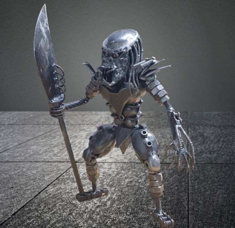 A recycled metal alien made from car parts