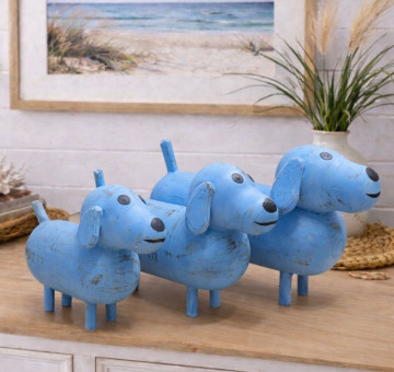 a set of 3 white dog ornaments, wooden and hand painted with a chalky white paint