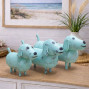 a set of 3 turquoise dog ornaments, wooden and hand painted with a chalky white paint