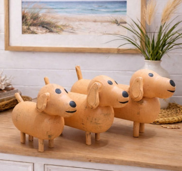 a set of 3 white dog ornaments, wooden and hand painted with a chalky white paint