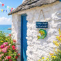 a wooden painted sign for a fisherman. Fishing is tough but I can tackle it