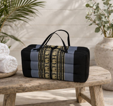 kapok filled handmade cushion shaped to give neck support, foldable with holding handles