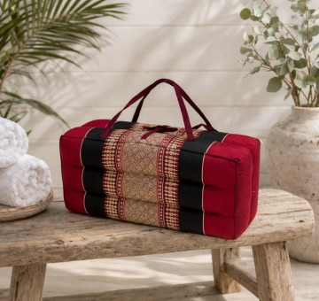 kapok filled handmade cushion shaped to give neck support, foldable with holding handles