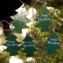 handmade and hand painted 5 green wooded christmas trees hanging on a garland string for seasonal decor
