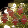 handmade and hand painted 5 red wooded christmas trees hanging on a garland string for seasonal decor