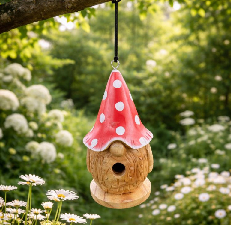 a hand carved bird nesting box in the shape of a highland cow with waves of fur