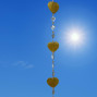a hanging suncatcher made from mirrors and cut out shells